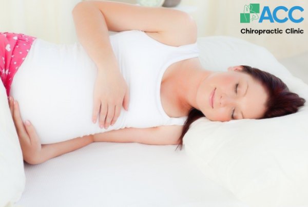 đau lưng có phải dấu hiệu mang thai
